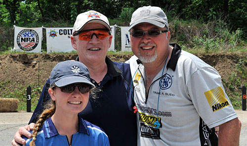 Molly Smith, the youngest member of Team Smith & Wesson, with Jim Shepherd and Yamil Sued